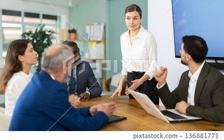 woman holding a meeting in an law company woman holding a meeting in an law company 136881771