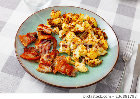 Plate of tasty boiled cauliflower with fried lard and sauce Plate of tasty boiled cauliflower with fried lard and sauce 136881798