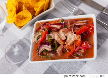 Ceviche served with fried banana in bowl Ceviche served with fried banana in bowl 136881898