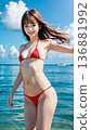 Smiling young woman in bikini swimsuit on summer beach 136881992