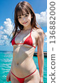 Smiling young woman in bikini swimsuit on summer beach 136882000