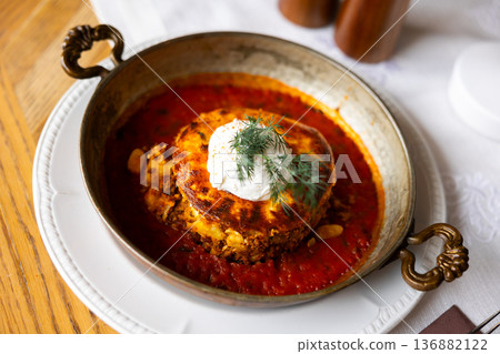 Bulgarian moussaka dish in a round plate Bulgarian moussaka dish in a round plate 136882122