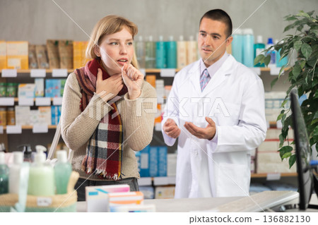 Girl pharmacy client suffers from sore throat and cold, pharmacist want to help 136882130