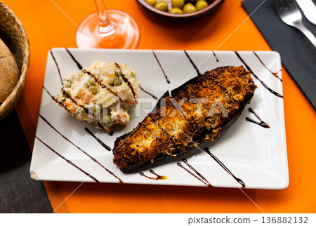 Russian salad and stuffed baked eggplant Russian salad and stuffed baked eggplant 136882132