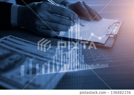 Stock market or forex trading graph and candlestick chart suitable for financial investment concept. Economy trends background for business idea and all art work design. Abstract finance background. Stock market or forex trading graph and candlestick chart suitable for financial investment concept. Economy trends background for business idea and all art work design. Abstract finance background. 136882156