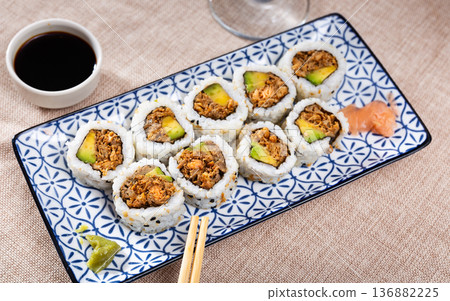 Rolls with salmon fish, avocado and fried onions Rolls with salmon fish, avocado and fried onions 136882225