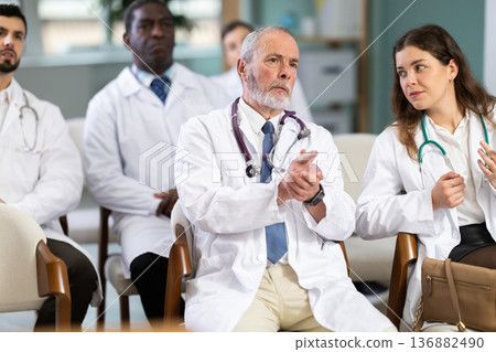 Doctors of different ages at the conference Doctors of different ages at the conference 136882490