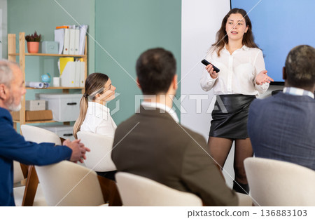 Young woman speaker speaking at a seminar Young woman speaker speaking at a seminar 136883103