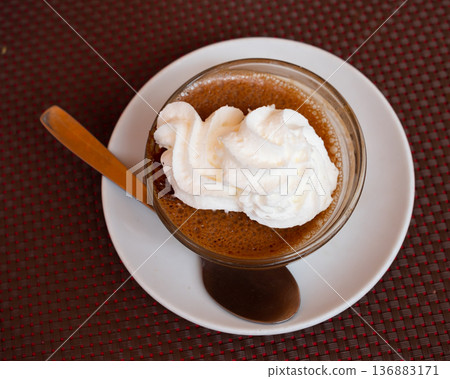 Most popular dessert is coffee and cream. French mousse in glass cup Most popular dessert is coffee and cream. French mousse in glass cup 136883171
