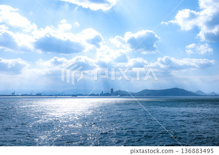 Takamatsu City, Kagawa Prefecture, with skyscrapers visible from the ferry bound for Ogijima Takamatsu City, Kagawa Prefecture, with skyscrapers visible from the ferry bound for Ogijima 136883495
