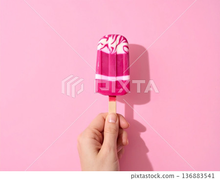 colorful lollipop in hand, Ice cream 136883541