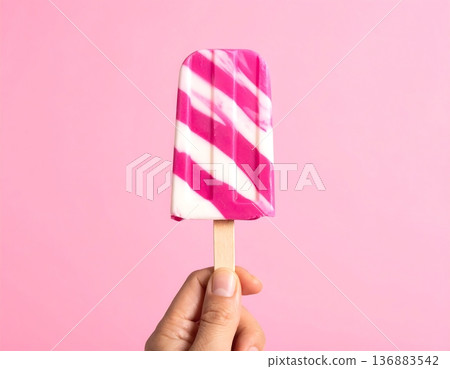 colorful lollipop in hand, Ice cream 136883542