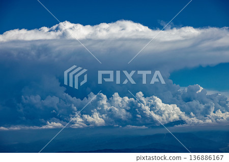 Cumulonimbus clouds and the mountain range towards Mt. Gassan seen from the summit of Mt. Chokai and Mt. Shinzan Cumulonimbus clouds and the mountain range towards Mt. Gassan seen from the summit of Mt. Chokai and Mt. Shinzan 136886167