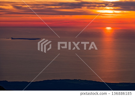 Sunset over the Sea of Japan and Tobishima Island seen from Mt. Chokai Sunset over the Sea of Japan and Tobishima Island seen from Mt. Chokai 136886185
