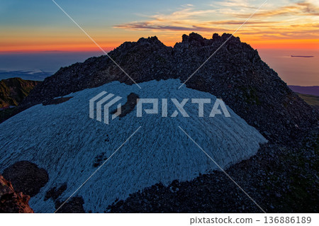 The summit of Shinzan and the Sea of Japan in the afterglow seen from Mount Chokai and the Seven High Mountains The summit of Shinzan and the Sea of Japan in the afterglow seen from Mount Chokai and the Seven High Mountains 136886189