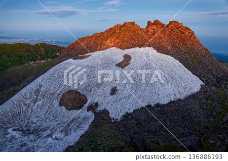 The summit of Shinzan in the morning glow seen from Mount Chokai and the Seven High Mountains The summit of Shinzan in the morning glow seen from Mount Chokai and the Seven High Mountains 136886193