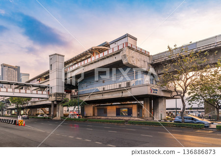 View of the Mo Chit BTS Skytrain station structure over Phahonyothin Road during the late afternoon in the Chatuchak district 136886873