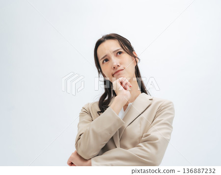 Worried female business person Worried female business person 136887232