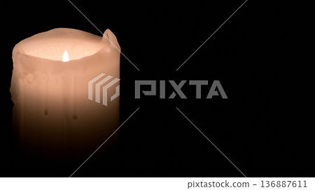 A candle lit in the darkness A candle lit in the darkness 136887611