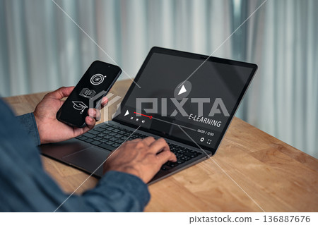 E-learning technology shows a person at an online course on a laptop and phone, so you can learn new skills, connection and education, while holding education icons, and learn more via video 136887676
