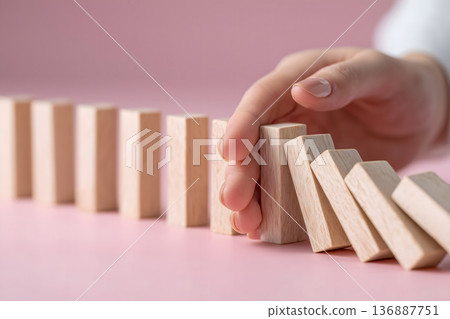 Person is holding a wooden block 136887751