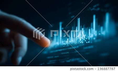 Finger is pointing at a graph with a lot of numbers Finger is pointing at a graph with a lot of numbers 136887787