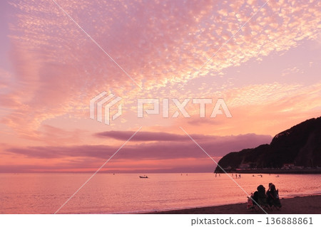 A calm beach at dusk, dyed crimson red A calm beach at dusk, dyed crimson red 136888861