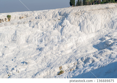 Stunning White Travertine Terraces Showcase Natural Beauty in Pamukkale, Turkey During a Sunny Afternoon Stunning White Travertine Terraces Showcase Natural Beauty in Pamukkale, Turkey During a Sunny Afternoon 136889875