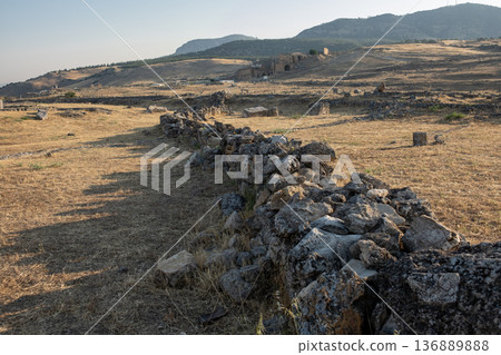 Explore the Ancient Ruins of Pamukkale and Its Unique Landscape Under the Warm Sunlight in Late Afternoon 136889888