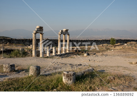 Explore the Ancient Ruins of Pamukkale With Scenic Views of Historic Columns and Surrounding Landscapes During Golden Hour 136889892