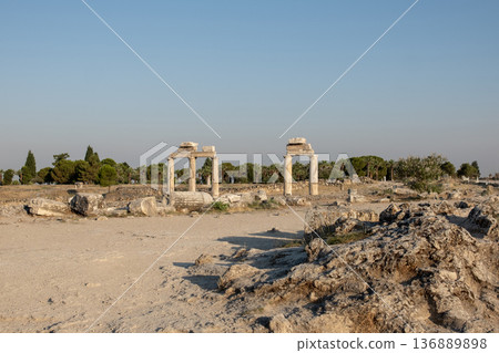 Exploring the Ancient Ruins of Pamukkale With Scenic Landscapes and Historical Significance at Sunset Exploring the Ancient Ruins of Pamukkale With Scenic Landscapes and Historical Significance at Sunset 136889898