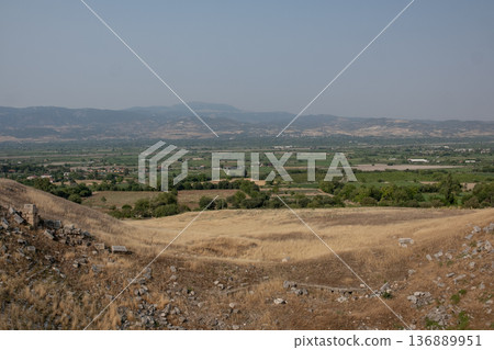 Ruins of Ancient Town of Laodikeia Overlook Fertile Valley Under Clear Sky Ruins of Ancient Town of Laodikeia Overlook Fertile Valley Under Clear Sky 136889951
