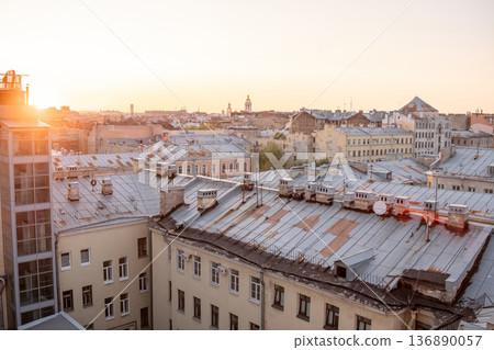Sunset Over Rooftops in St. Petersburg Highlighting Urban Architecture and City Life Sunset Over Rooftops in St. Petersburg Highlighting Urban Architecture and City Life 136890057