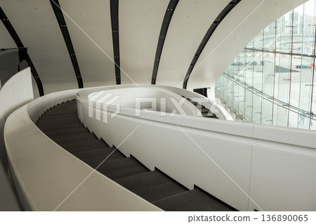 Contemporary Spiral Staircase Inside Modern Architectural Structure During the Day With Large Glass Windows Illuminating the Space Contemporary Spiral Staircase Inside Modern Architectural Structure During the Day With Large Glass Windows Illuminating the Space 136890065