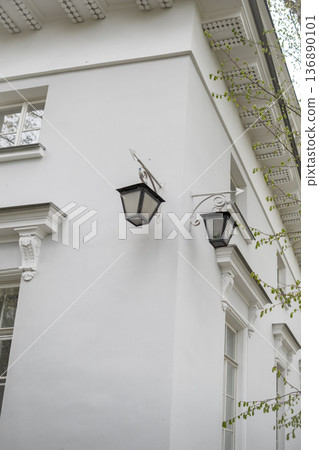 Elegant White Building Showcasing Vintage Lanterns and Classic Architecture in a Serene Urban Setting During the Daytime Elegant White Building Showcasing Vintage Lanterns and Classic Architecture in a Serene Urban Setting During the Daytime 136890101