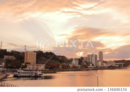 A seaside town dyed crimson and an anchored ship A seaside town dyed crimson and an anchored ship 136890150