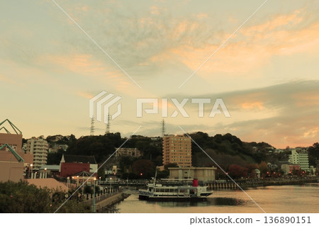 A calm sunset where the sky and sea blend together A calm sunset where the sky and sea blend together 136890151