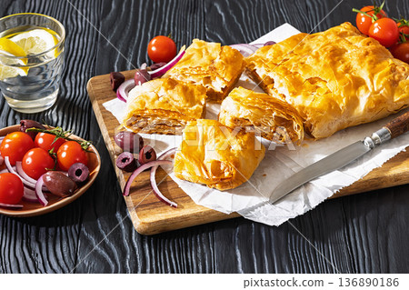 Greek savory sliced meat bougatsa pie with olives 136890186