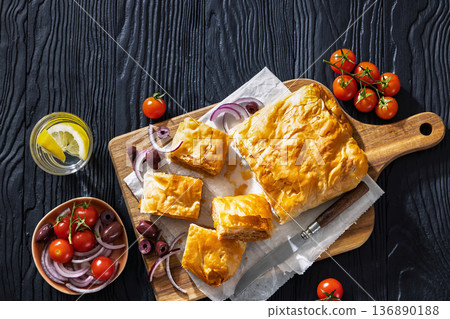 Greek savory sliced meat bougatsa pie with olives 136890188
