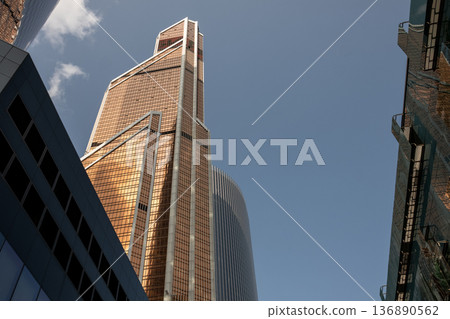 Moscow City Skyline Features Modern Architecture With Towering Skyscrapers Under a Clear Blue Sky During Daylight Hours Moscow City Skyline Features Modern Architecture With Towering Skyscrapers Under a Clear Blue Sky During Daylight Hours 136890562