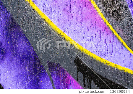 Purple and Yellow Urban Graffiti Abstract on Textured Wall in 90s, Y2K Street Style 136890924