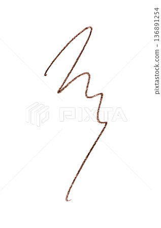 A brown stroke from a cosmetic eyebrow pencil. Isolated on a white background. A brown stroke from a cosmetic eyebrow pencil. Isolated on a white background. 136891254