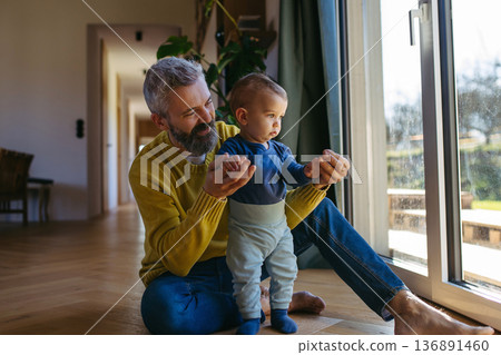 Father with little toddler son at home. Father with little toddler son at home. 136891460