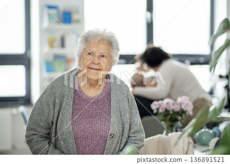 Smiling elderly woman looking at camera. 136891521