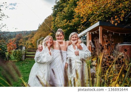Happy senior friends during wellness retreat. Happy senior friends during wellness retreat. 136891644