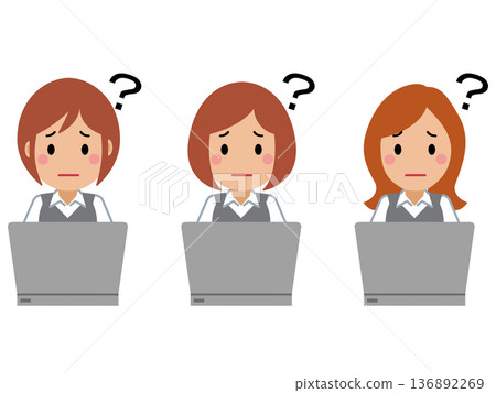 A young woman in gray office clothes operating a computer with a troubled look on her face A young woman in gray office clothes operating a computer with a troubled look on her face 136892269