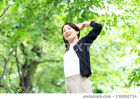 Middle-aged woman, fresh greenery, growth 136892714