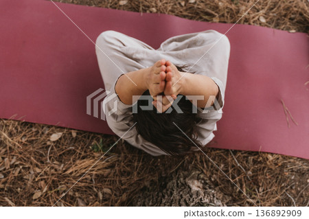 Top View of Peaceful Outdoor Yoga Practice Top View of Peaceful Outdoor Yoga Practice 136892909