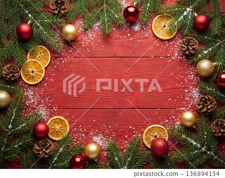 Christmas background on red wooden table with fir branches and decorations 136894154
