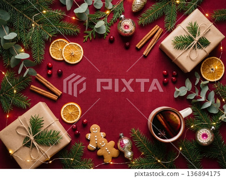 Christmas flat lay background with gifts, mulled wine, and gingerbread cookies on red 136894175